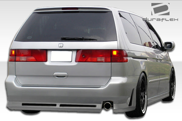 1999-2004 Honda Odyssey Duraflex R34 Body Kit - 4 Piece - Includes R34 Front Bumper Cover (102111) R34 Rear Bumper Cover (102112) R34 Side Skirts Rocker Panels (102113)