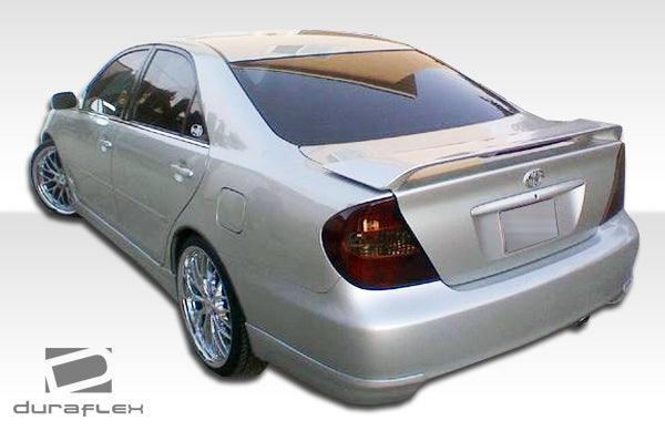 2002-2004 Toyota Camry Duraflex Vortex Body Kit - 6 Piece - Includes Vortex Front Lip Under Spoiler Air Dam (104216) Vortex Rear Add On Bumper Spat Extensions (104218) Vortex Side Skirts Rocker Panels (104217) Vortex Front Grille (104215)