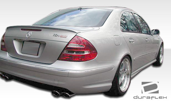 2003-2006 Mercedes E Class W211 4dr Duraflex AMG Body Kit - 4 Piece - Includes AMG Style Front Bumper Cover (103143) AMG Style Rear Bumper Cover (103145) AMG Style Side Skirts Rocker Panels (103144)