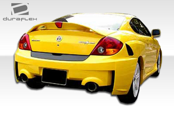 2003-2006 Hyundai Tiburon Duraflex SC-5 Body Kit - 6 Piece - Includes SC-5 Front Bumper Cover (100447) SC-5 Rear Bumper Cover (100448) SC-5 Side Skirts Rocker Panels (100450) SC-5 Rear Fender Flares (100449)