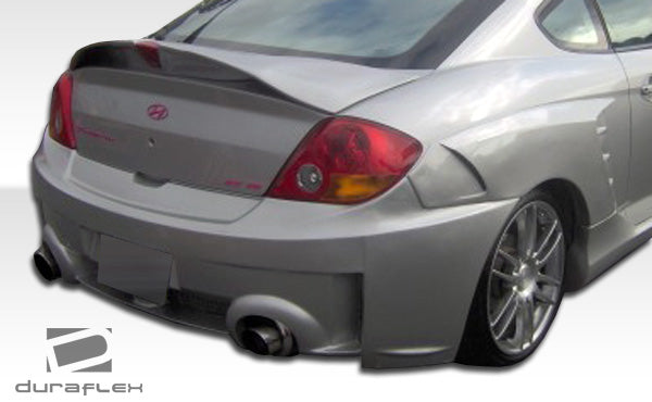 2003-2006 Hyundai Tiburon Duraflex SC-5 Body Kit - 6 Piece - Includes SC-5 Front Bumper Cover (100447) SC-5 Rear Bumper Cover (100448) SC-5 Side Skirts Rocker Panels (100450) SC-5 Rear Fender Flares (100449)