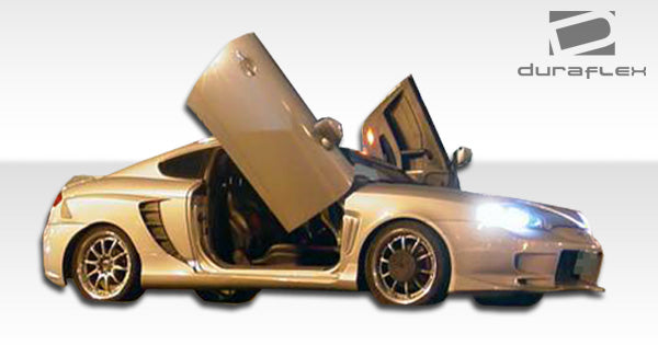 2003-2006 Hyundai Tiburon Duraflex SC-5 Body Kit - 6 Piece - Includes SC-5 Front Bumper Cover (100447) SC-5 Rear Bumper Cover (100448) SC-5 Side Skirts Rocker Panels (100450) SC-5 Rear Fender Flares (100449)
