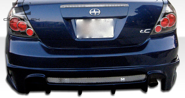 2005-2010 Scion tC Duraflex Raven Body Kit - 4 Piece - Includes Raven Front Bumper Cover (100671) Raven Rear Bumper Cover (100672) Raven Side Skirts Rocker Panels (100673)