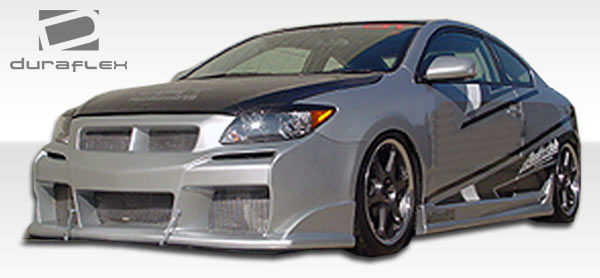 2005-2010 Scion tC Duraflex R34 Body Kit - 4 Piece - Includes R34 Front Bumper Cover (103457) Raven Side Skirts Rocker Panels (100672) Raven Rear Bumper Cover (100673)