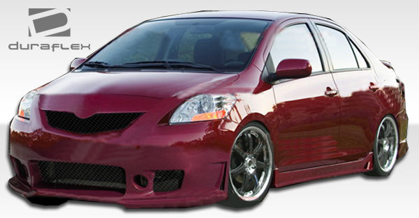 2007-2011 Toyota Yaris 4DR Duraflex B-2 Body Kit - 4 Piece - Includes B-2 Front Bumper Cover (103392) B-2 Side Skirts Rocker Panels (103393) B-2 Rear Bumper Cover (103394)