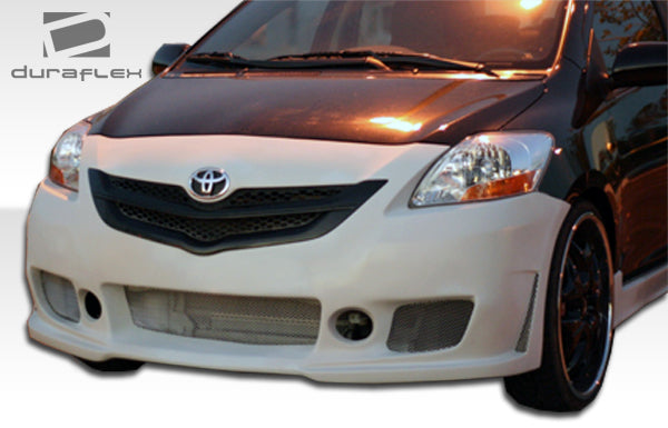 2007-2011 Toyota Yaris 4DR Duraflex B-2 Body Kit - 4 Piece - Includes B-2 Front Bumper Cover (103392) B-2 Side Skirts Rocker Panels (103393) B-2 Rear Bumper Cover (103394)