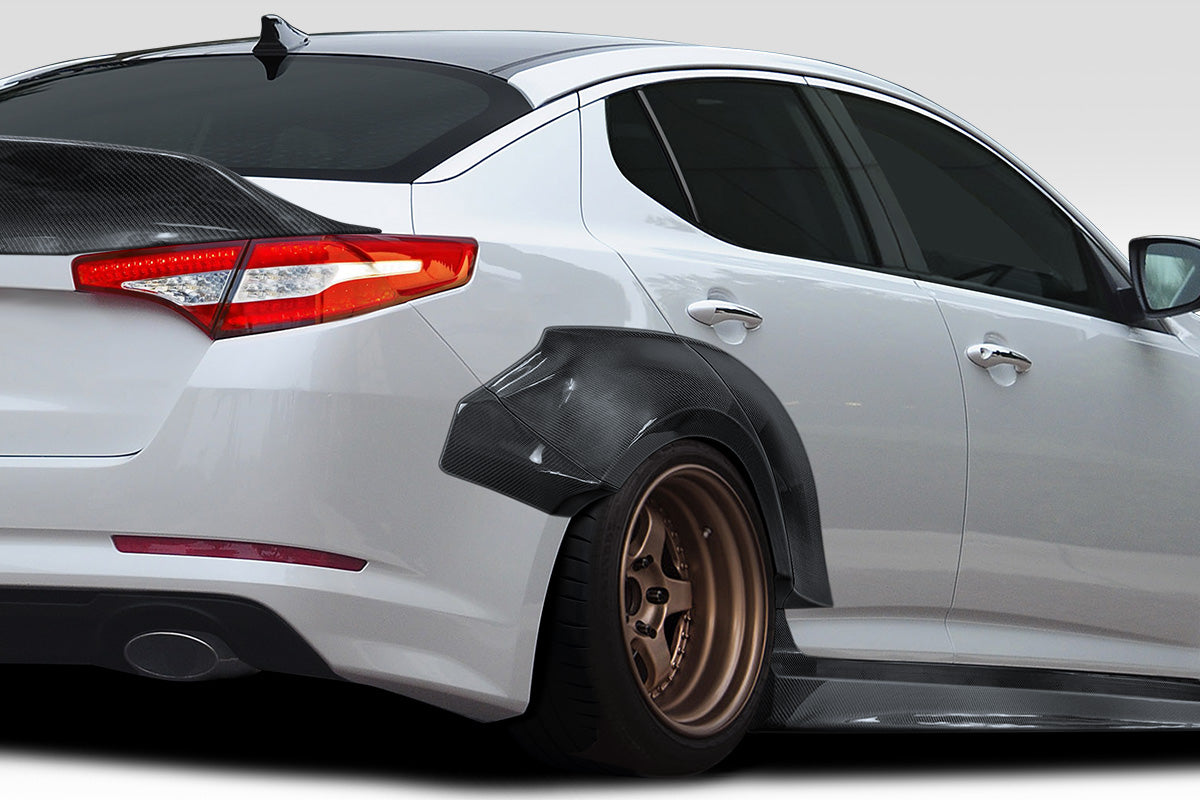 2011-2013 Kia Optima Carbon Creations CPR Body Kit - 14 Piece - Includes 116098 CPR Front Lip, 116247 CPR Side Skirts,, 116248 CPR Front Fender Flares, 116249 CPR Rear Fender Flares. 116246 CPR Rear Wing Spoiler