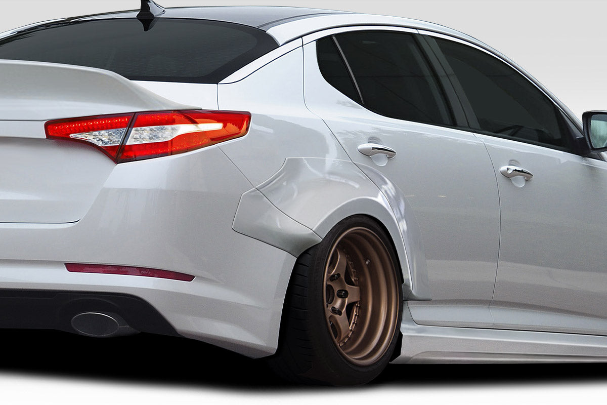 2011-2013 Kia Optima Duraflex CPR Body Kit - 14 Piece - Includes 116099 CPR Front Lip, 116103 CPR Side Skirts,, 116104 CPR Front Fender Flares, 116105 CPR Rear Fender Flares. 116102 CPR Rear Wing Spoiler