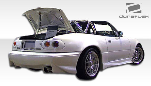 1990-1997 Mazda Miata Duraflex VX Body Kit - 4 Piece - Includes VX Front Bumper Cover (104492) VX Rear Bumper Cover (104493) Vader Side Skirts Rocker Panels (100963)