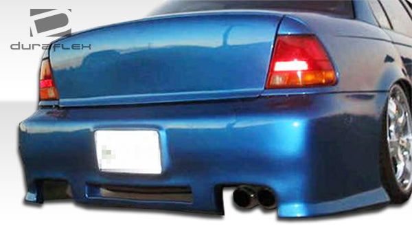 1996-1999 Saturn SL Duraflex R34 Body Kit - 4 Piece - Includes R34 Front Bumper Cover (101797) Spyder Rear Bumper Cover (101795) M3 Side Skirts Rocker Panels (101796)