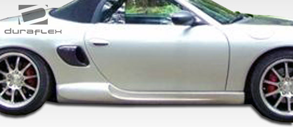 1997-2004 Porsche Boxster Duraflex G-Sport Body Kit - 4 Piece - Includes G-Sport Front Lip Under Spoiler Air Dam (105137) G-Sport Rear Lip Under Spoiler Air Dam (105139) G-Sport Side Skirts Rocker Panels (105138)