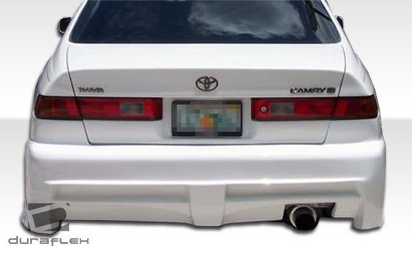 1997-2001 Toyota Camry Duraflex R34 Body Kit - 4 Piece - Includes R34 Front Bumper Cover (101929) Xtreme Rear Bumper Cover (101925) Xtreme Side Skirts Rocker Panels (101926)